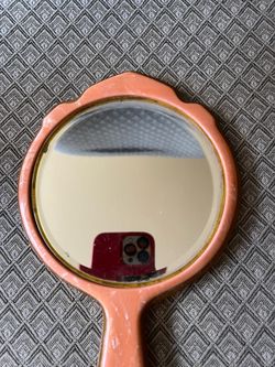 Vintage hand-held beveled mirror