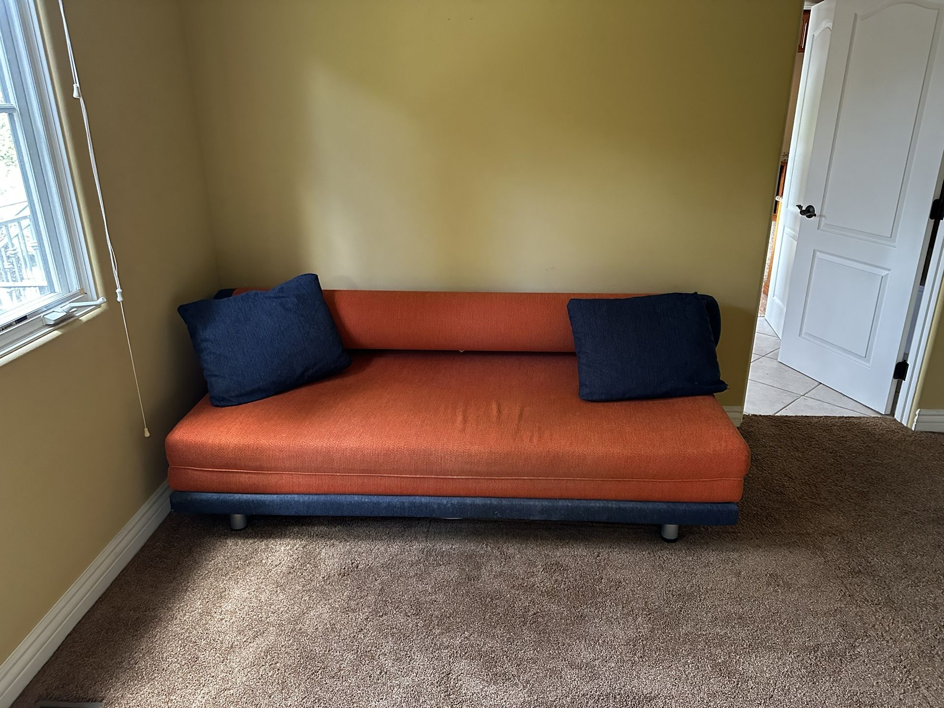 Really Cool Futon Couch That Makes Into A Huge King Size Bed. 
