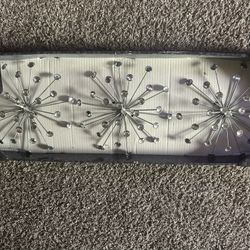 Silver starburst wall decor