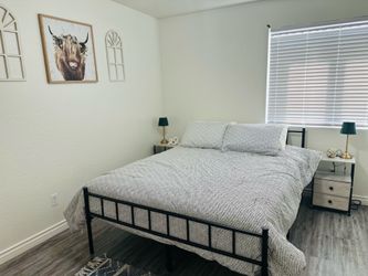Queen bed with side tables and mattress