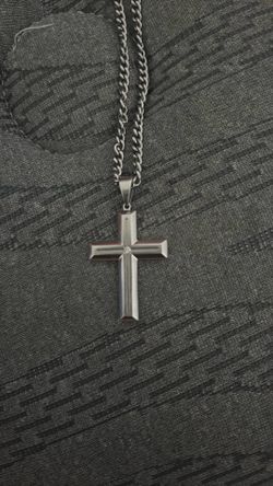 cross necklace with diamond in the middle