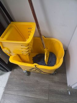 Mop bucket wringer wheels