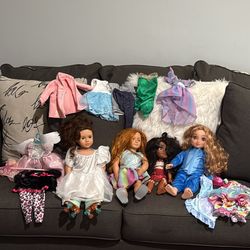4 beautiful dolls with clothes included