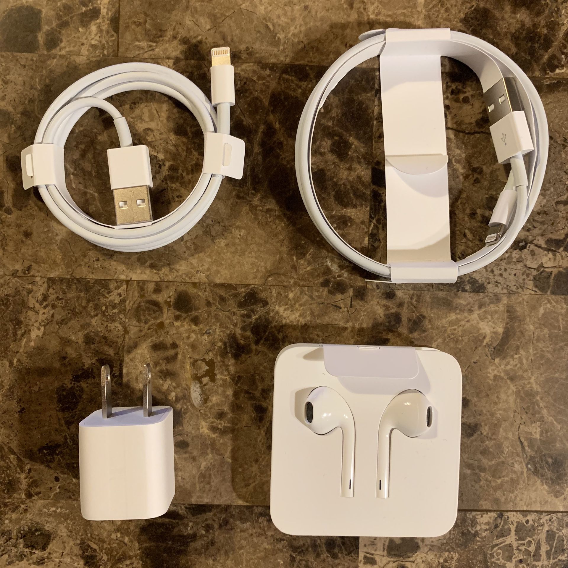 Apple charger, earbuds, and power adapter