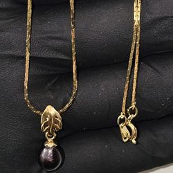 14K Gold 18" Chain with Black Pearl pendant.