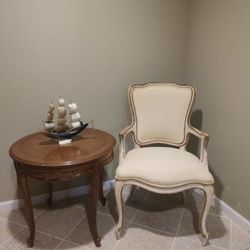  French Louis XV-style armchair, characterized by its curving back,