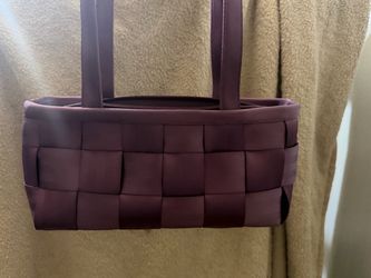 Harveys woven seatbelt satchel bag in a rich blackberry hue, featuring a classic basket-weave design with dual top handles