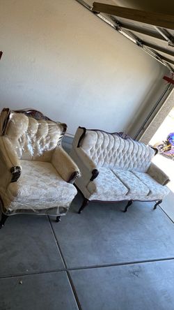Vintage French provincial tufted sofa and a wingback armchair