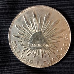 Mexican silver 8 Reales "Cap and Rays" coin, minted in Zacatecas in 1882. 