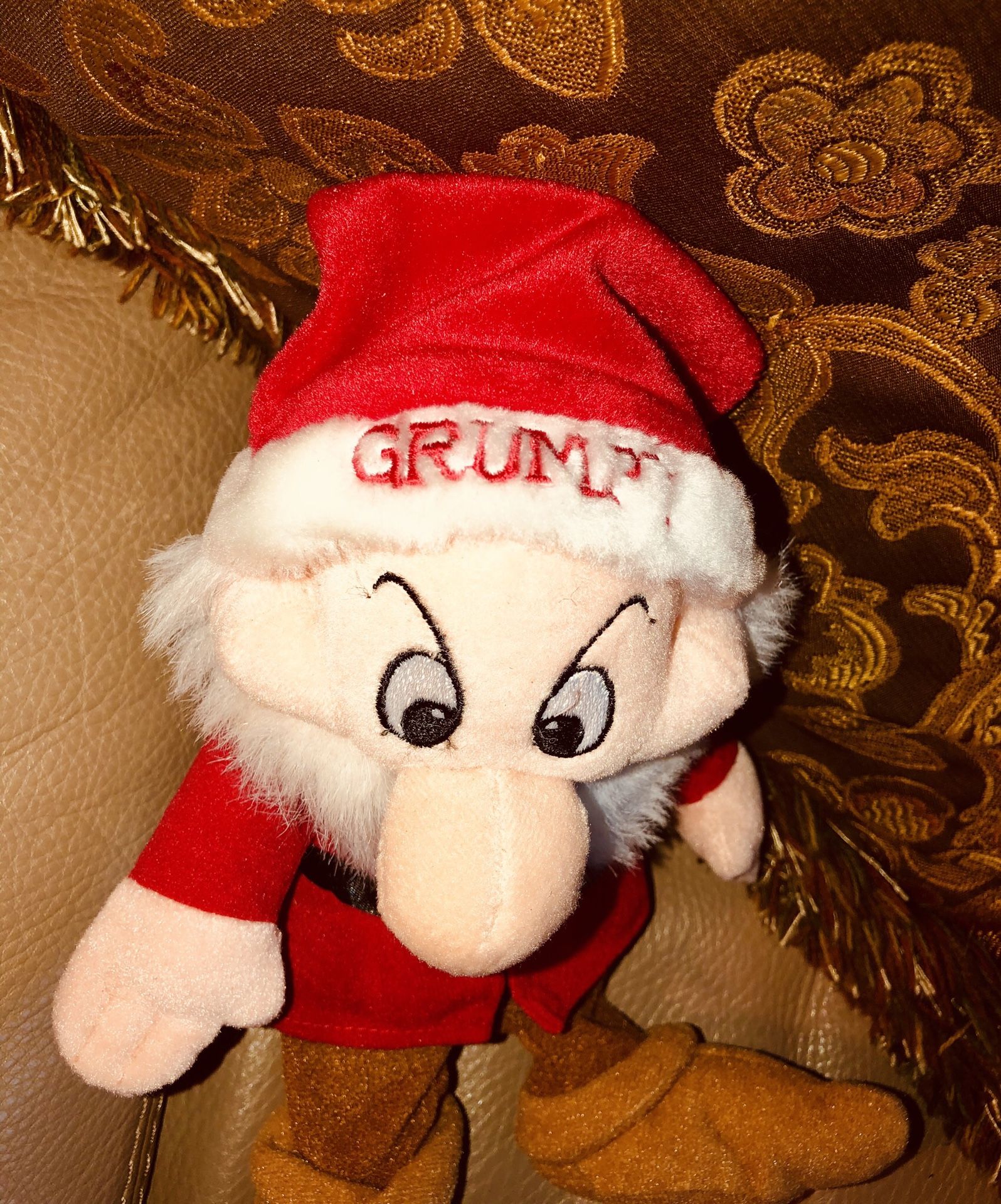 Grumpy wearing a Santa hat- Walt Disney World.