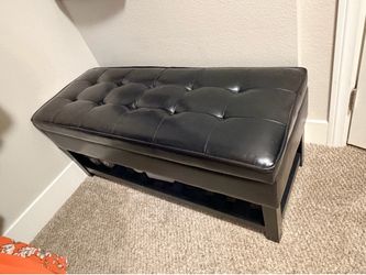 Black faux leather storage bench