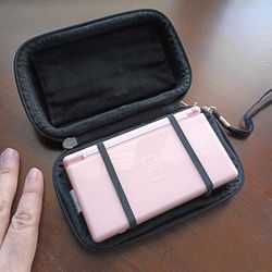 Pink DS Lite, comes with charger (missing stylus)