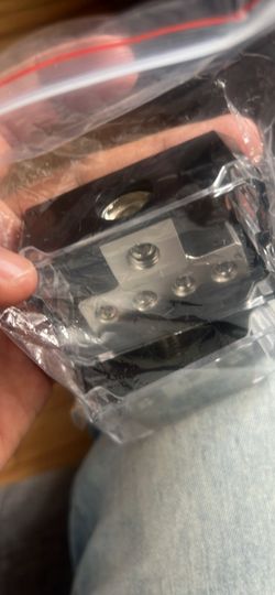 Black Metal Mechanical Component with Screws