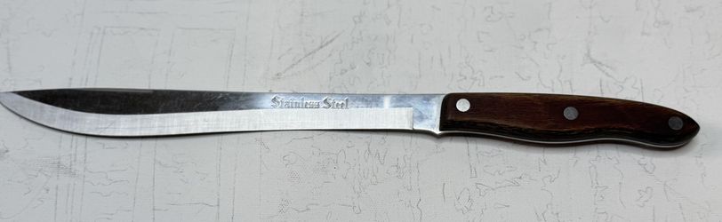 Typically described as an 11-inch chef's knife or a 9-inch carving knife. Materials: The blade is made of stainless steel, as indicated by the distinc