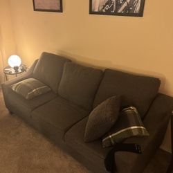 grey couch w/pullout queen mattress 