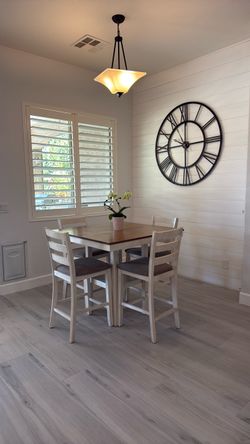 White bar table with chairs