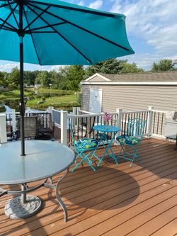 Teal metal bistro table and chairs