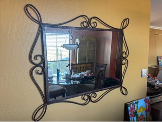 Wall mirror with elegant metal frame design