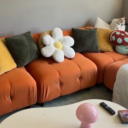 Orange boulce couch