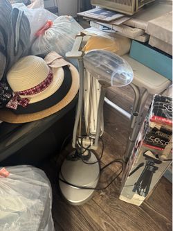 Work light with magnifying glass