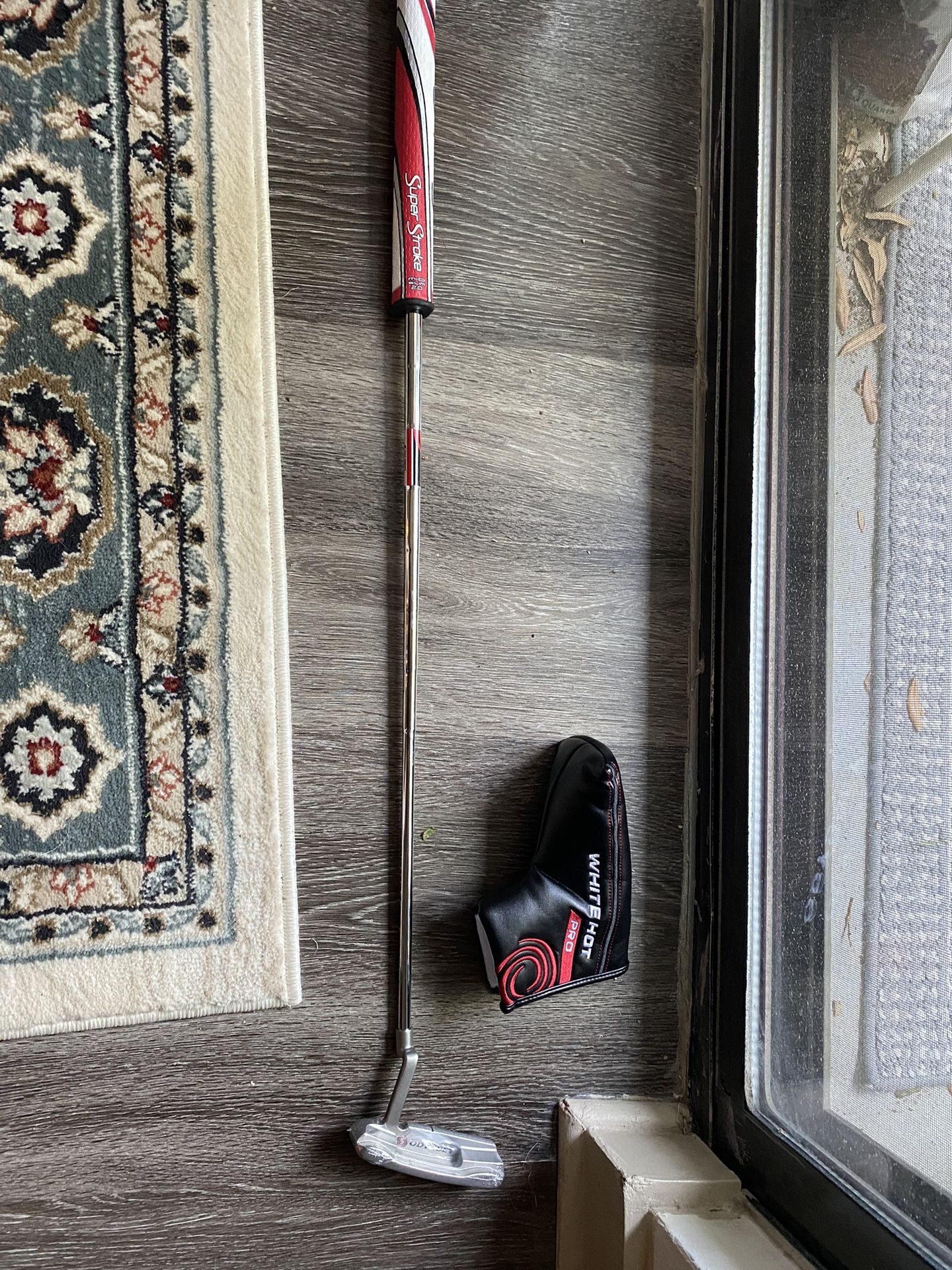 Odyssey White Hot Pro Putter with SuperStroke grip and head-cover