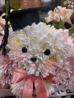 Graduation puppy flower arrangement