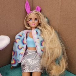 Barbie Cutie Reveal Doll with a Bunny Plush Costume and accessories.