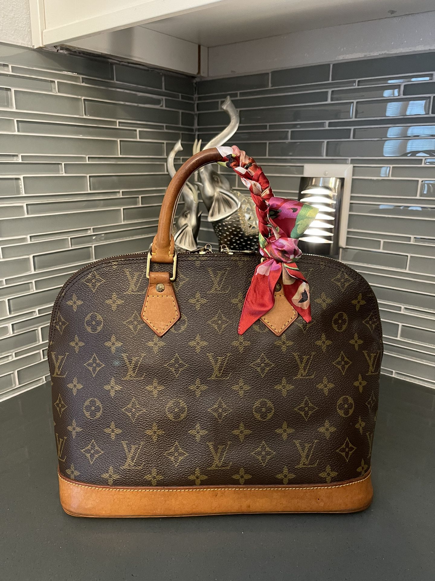 Louis Vuitton Alma Monogram Handbag 