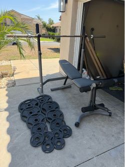 Bench press with 7ft 45lbs bar and 255lbs of Olympic weights