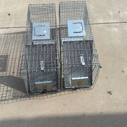 Havahart live-catch animal traps (you can see HAVAHART s