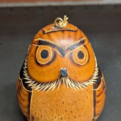 Gourd Owl 3x2 Ornament~ Decor, Handmade
beads inside shake.  
Thoughtful round owl ornament is made from an etched gourd. Artisans working with Manos 