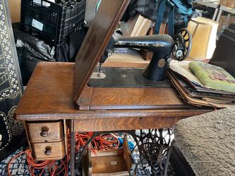 Antique Singer sewing machine with wood cover