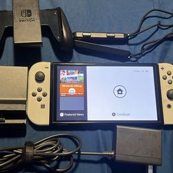 Nintendo switch oled with docking station and joycon grip 