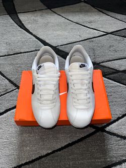 white nike cortez sneakers