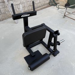 plate loaded standing hamstring curl machine