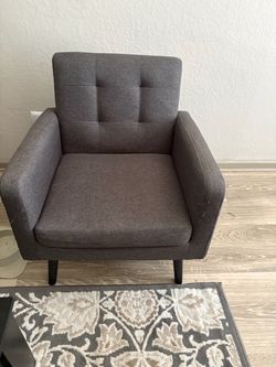 4 sitting chairs and a rug
