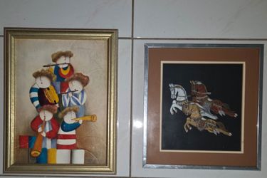Pair of vintage framed artworks. 14"x18" Joyce Roybal musicians painting, 16"x15" Thai silk horse painting. Good vintage condition.