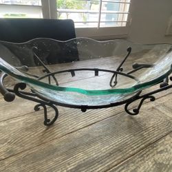  decorative glass bowl on a wrought-iron stand