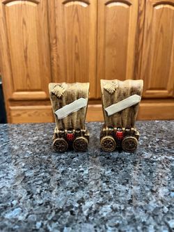 Vintage Ceramic Wagon Pair of Salt and Pepper Shakers.  Preowned one shaker on the side has paint wear and looks like a sticker was on the shaker .