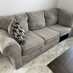 Delivery Available! Grey Upholstered Love Seat Living Room Sofa Couch! Clean and Comfortable! Good condition! Rip in back right corner, easy to concea