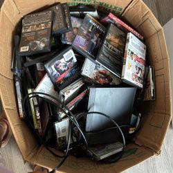 A Box Full Of Over 100 DVDs 