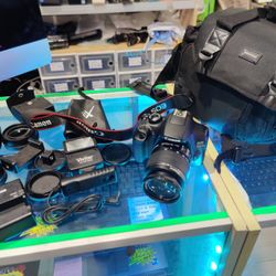 Canon EOS Rebel T5 Camera Bundle - Comes with a lot of extras. 18-55mm lens, Bag, Lens Filters etc