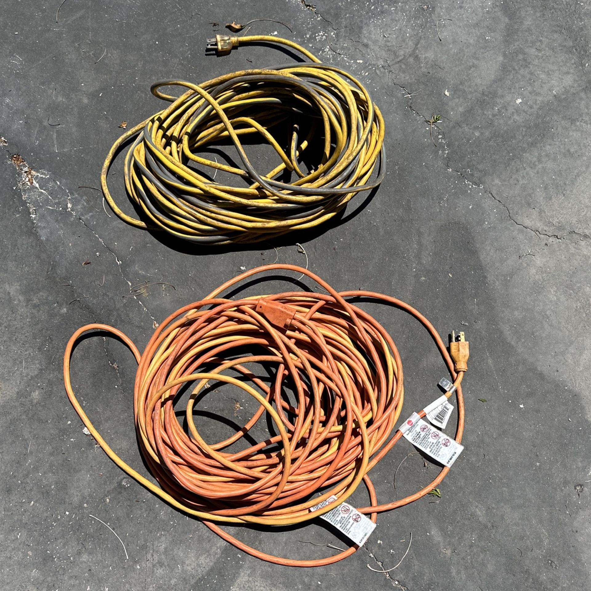 2 100 Ft Extension Cords, One Like New With Tags