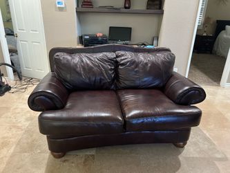 Brown sofa and loveseat