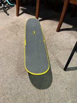 The skateboard features a Zero brand deck with a yellow design and the surname of skating legend Chris Cole.