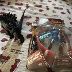 Neca godzilla figure and iron man figure