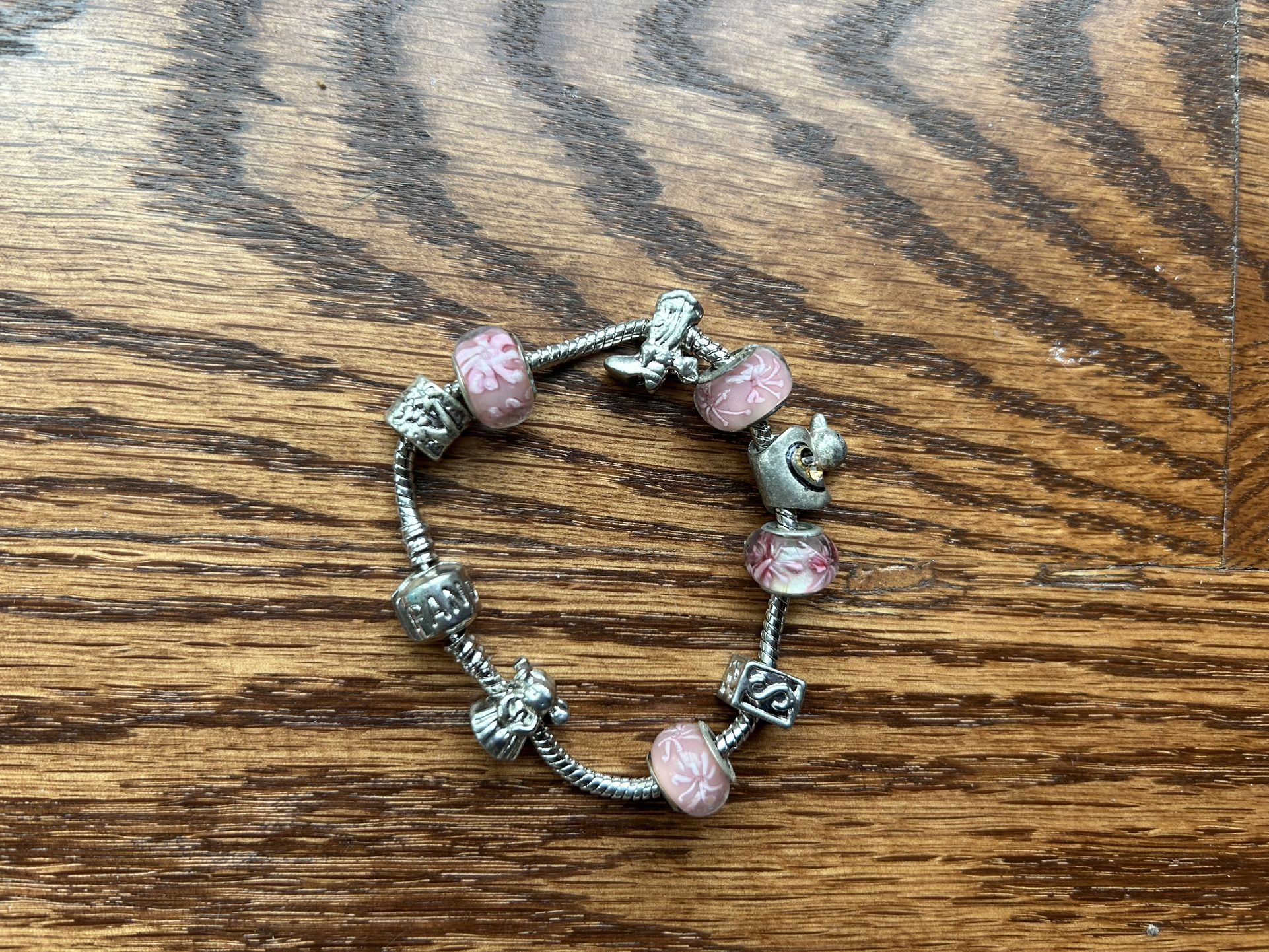 Pandora, Silver Bracelet In Pink With Angel, Little Girl, Flowers, And More Charms