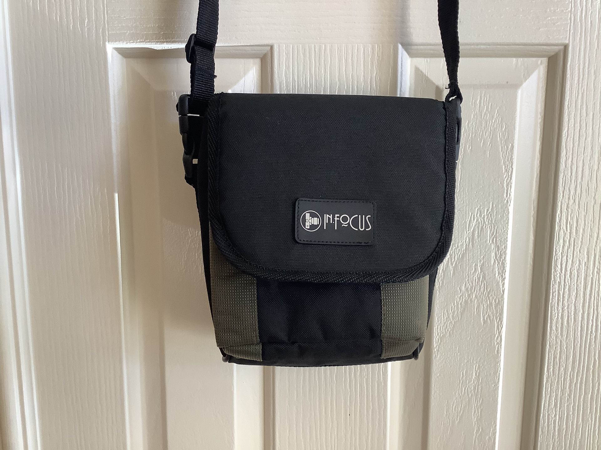 InFocus Padded Camera bag with adjustable shoulder strap and belt loop.