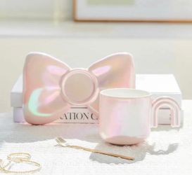 Very original bow tea/coffee cup with tea spoon and saucer. Holiday, gift for her