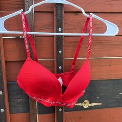 PINK, worn a few times, few gems are off, just ther than that good condition, $10 size 32c